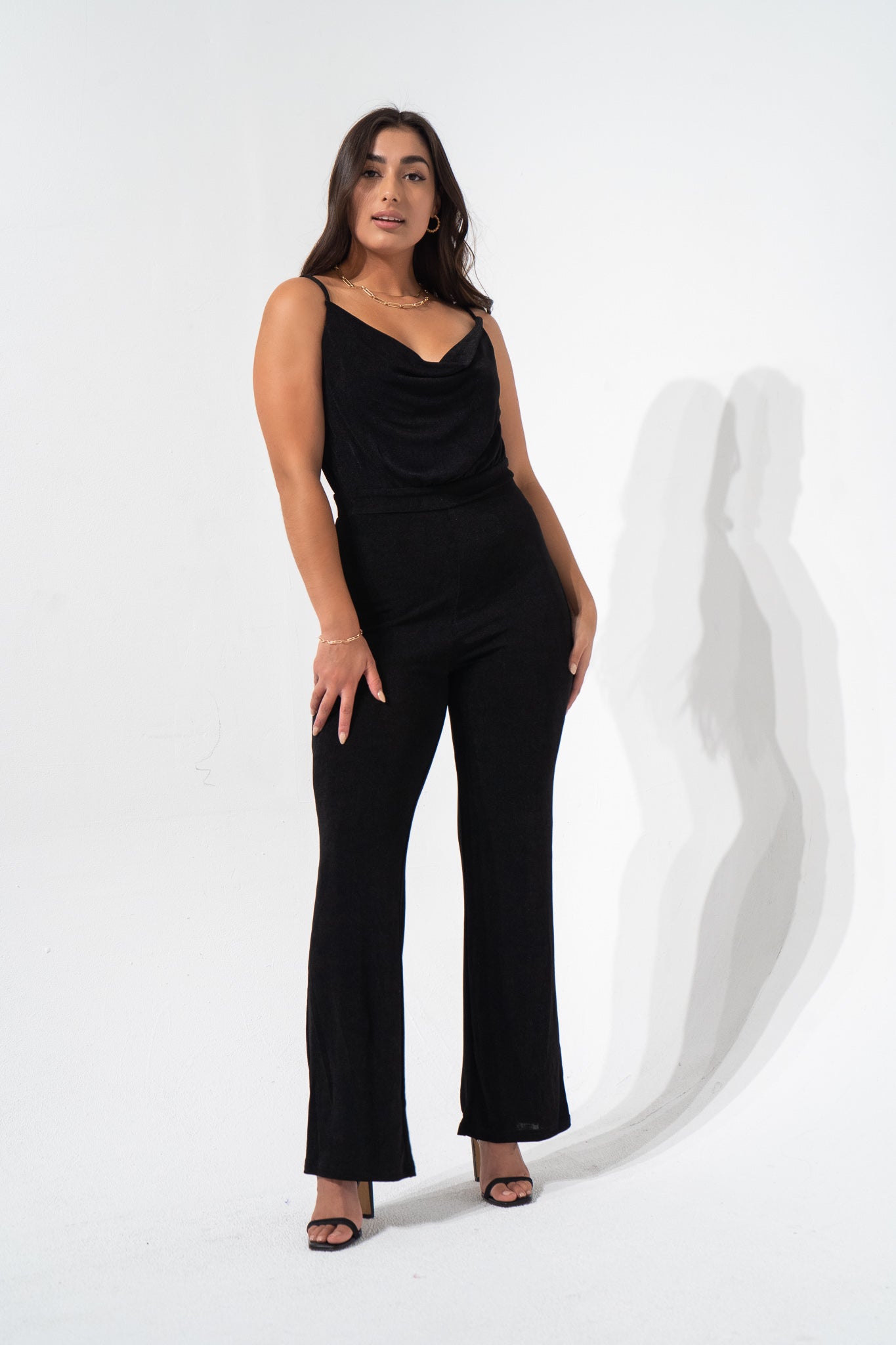 A true classic wardrobe staple. The Whiskey Neat Jumpsuit features a waistband that hugs the waist and shapes the mid-section, a cowl neck for a flattering neckline, thin adjustable straps and made from luxury slinky fabric that flows with your movement. Structured fit but made for comfort. 